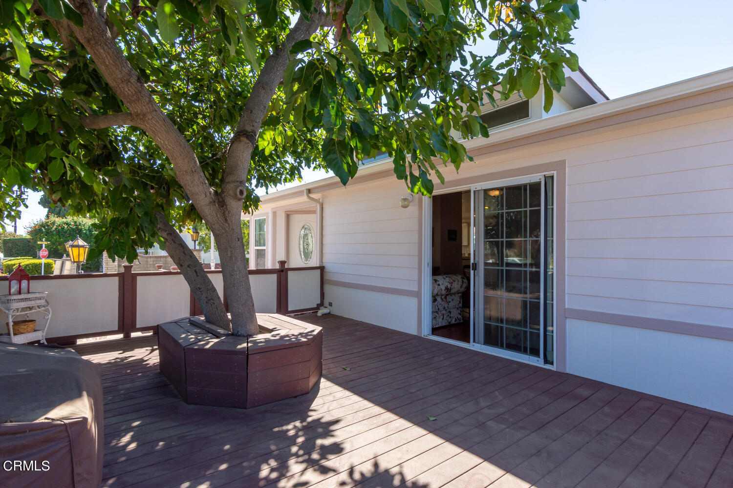 11405 Darling Road, Unit 1 Ventura, CA 93004 - Photo 25 of 31 a view of a house with a tub and a tree