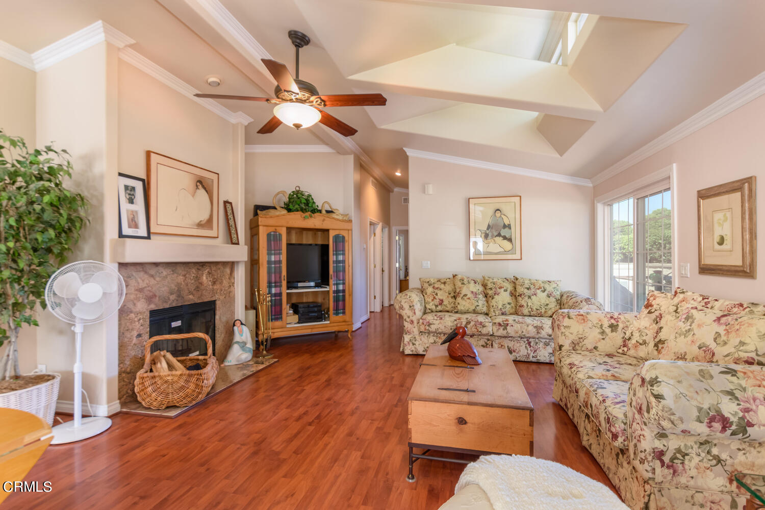 11405 Darling Road, Unit 1 Ventura, CA 93004 - Photo 6 of 31 a living room with furniture flat screen tv and a fireplace