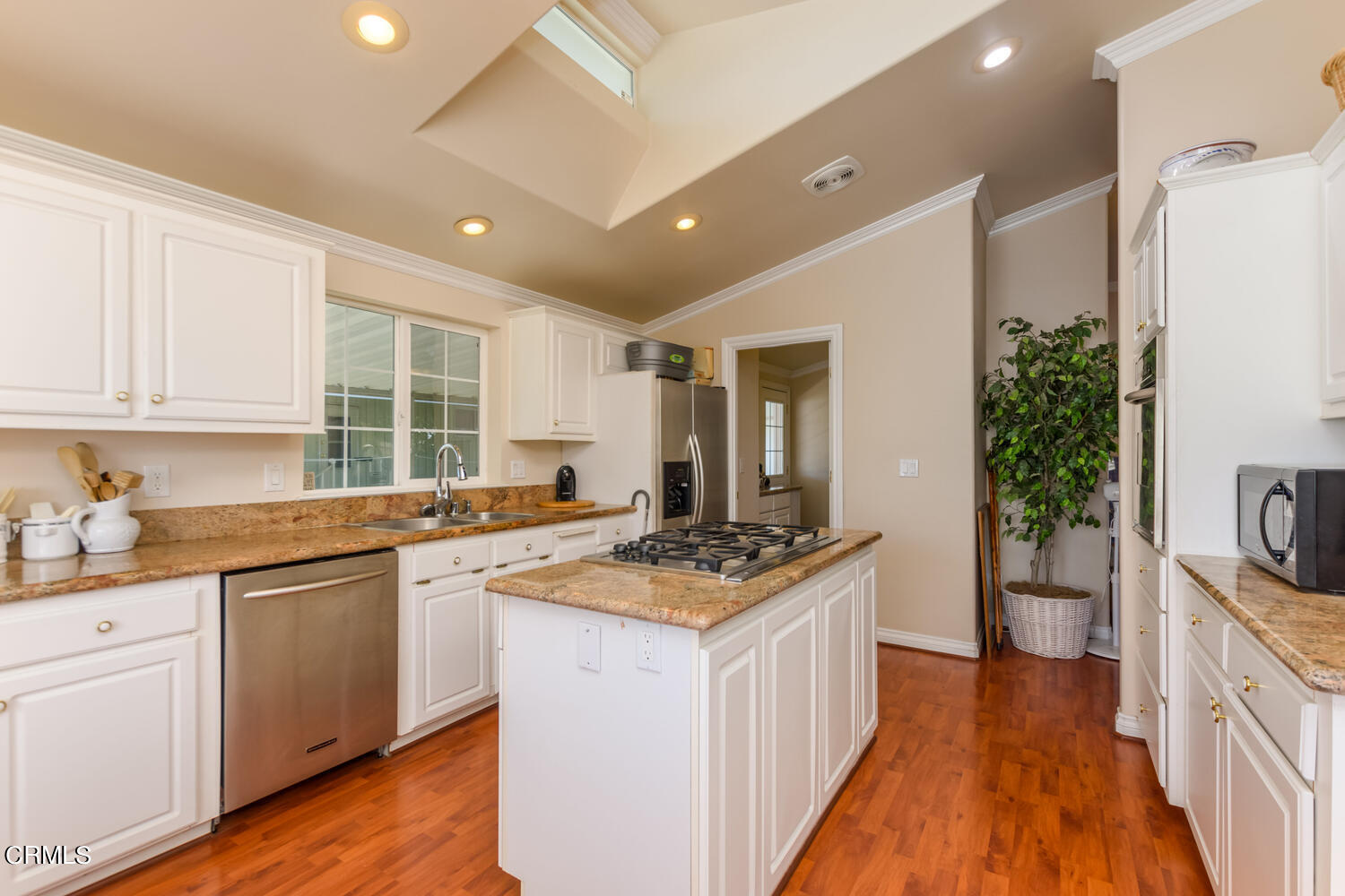 11405 Darling Road, Unit 1 Ventura, CA 93004 - Photo 9 of 31 a kitchen with sink stove and cabinets