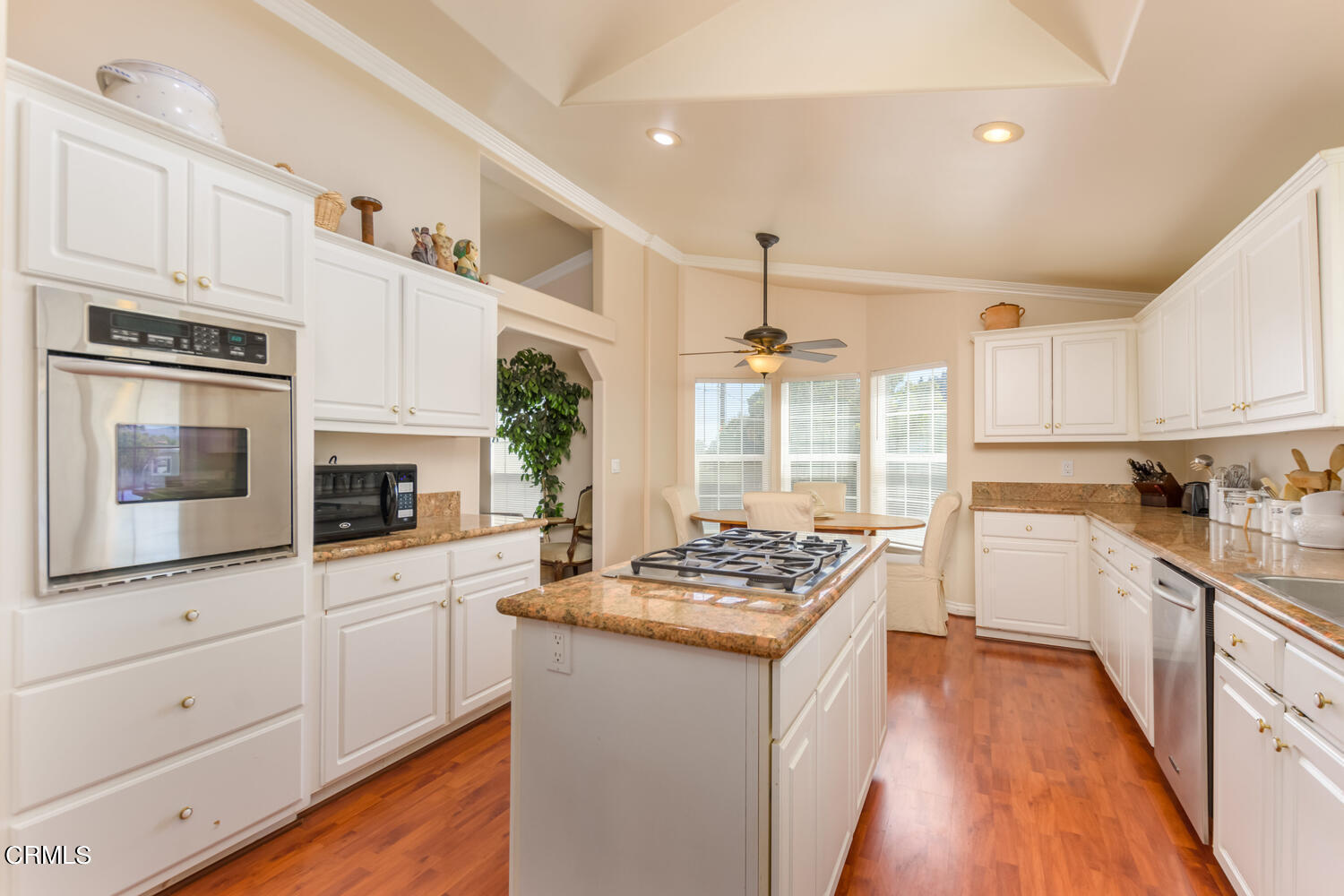 11405 Darling Road, Unit 1 Ventura, CA 93004 - Photo 10 of 31 a kitchen with granite countertop a sink stove and cabinets