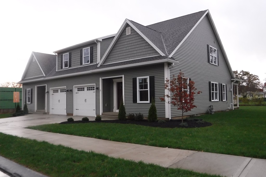 10 St Andrews Way, Unit 10 West Springfield, MA 01089 - Photo 1 of 1 a front view of a house with a garden and yard