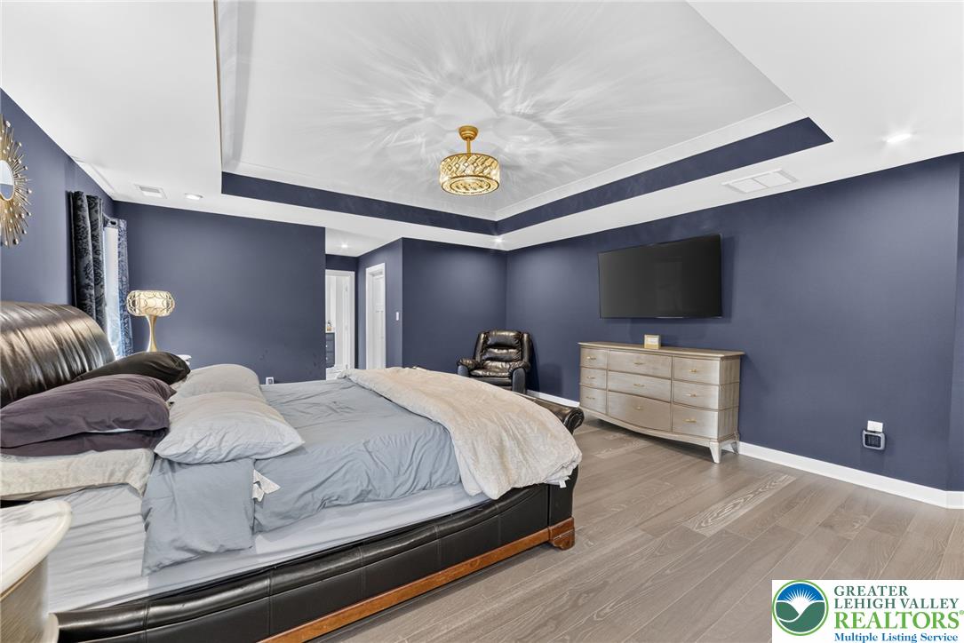 3952 Orth Street Bethlehem, PA 18020 - Photo 23 of 60 Recessed lighting and tray ceilings add depth to this spacious sleeping quarter.