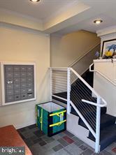 4742 Pine Street, Unit 104 Philadelphia, PA 19143 - Photo 3 of 12 a view of an entryway with staircase