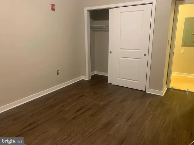 an empty room with wooden floor