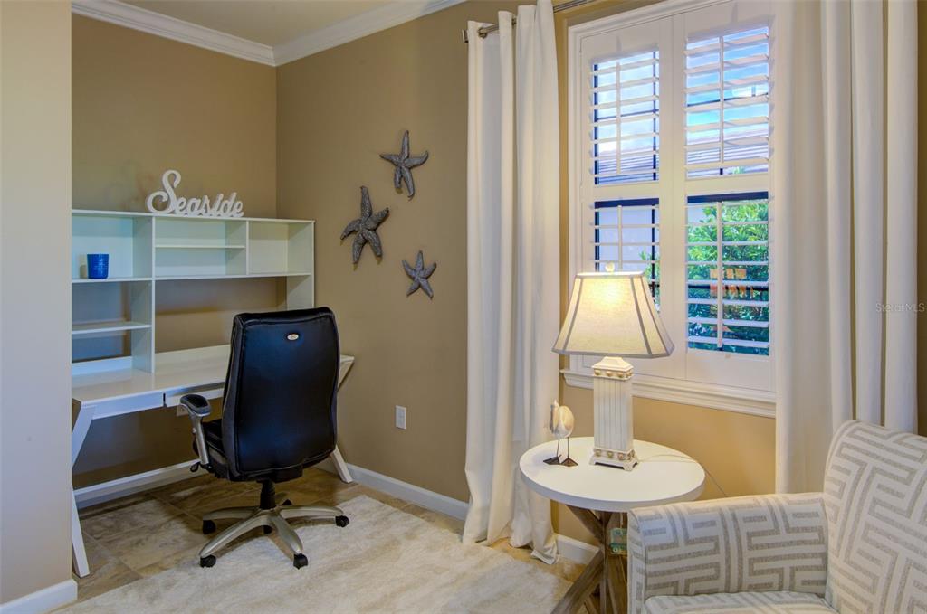 12232 Marsh Pointe Road Sarasota, FL 34238 - Photo 13 of 44 a view of a workspace with furniture and a window