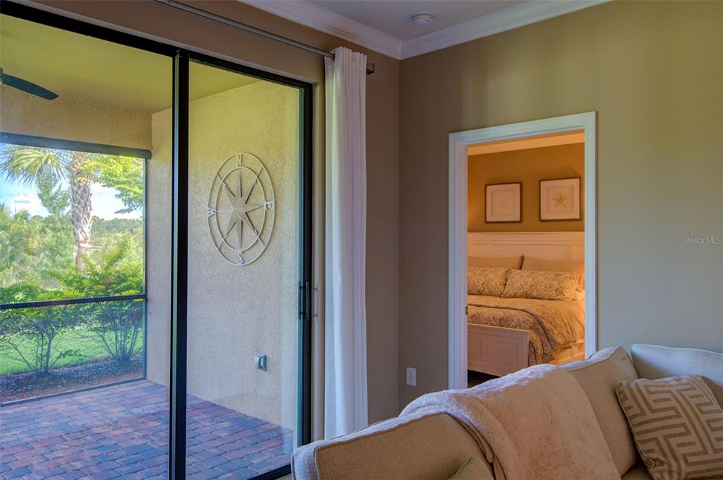 12232 Marsh Pointe Road Sarasota, FL 34238 - Photo 15 of 44 a bedroom with a bed and a window