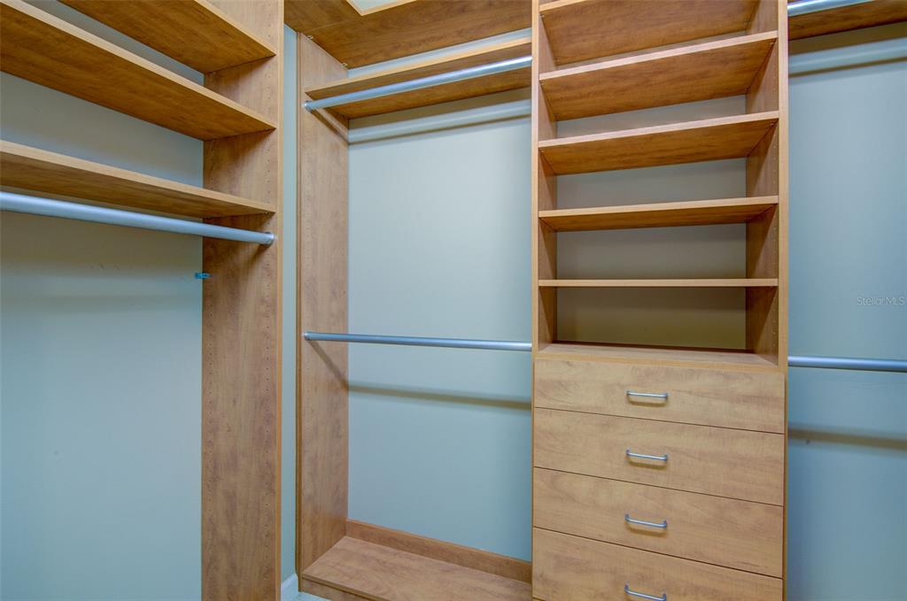 12232 Marsh Pointe Road Sarasota, FL 34238 - Photo 23 of 44 a view of walk in closet with empty racks