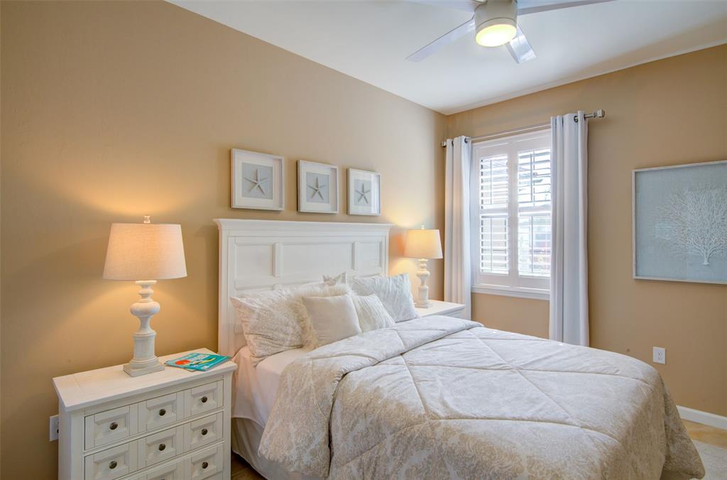 12232 Marsh Pointe Road Sarasota, FL 34238 - Photo 29 of 44 a bedroom with a bed and a window