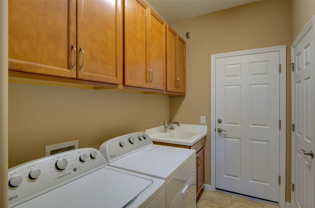 12232 Marsh Pointe Road Sarasota, FL 34238 - Photo 30 of 44 a utility room with dryer and washer