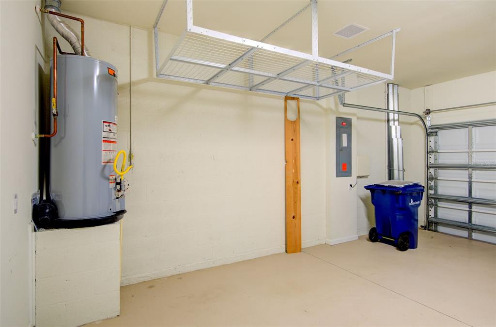 12232 Marsh Pointe Road Sarasota, FL 34238 - Photo 31 of 44 a utility room with stainless steel appliances and refrigerator