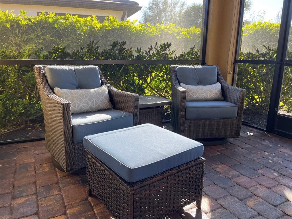 12232 Marsh Pointe Road Sarasota, FL 34238 - Photo 35 of 44 a view of a patio with couches chairs and a table
