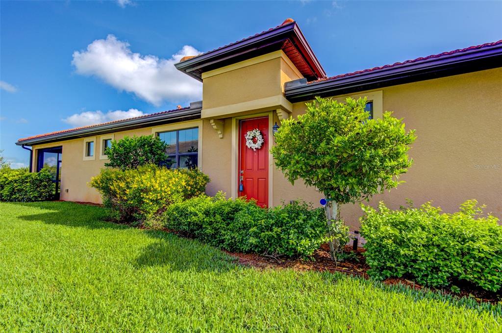 12232 Marsh Pointe Road Sarasota, FL 34238 - Photo 38 of 44 a front view of a house with garden