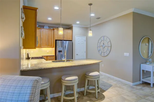 a kitchen with a table and chairs