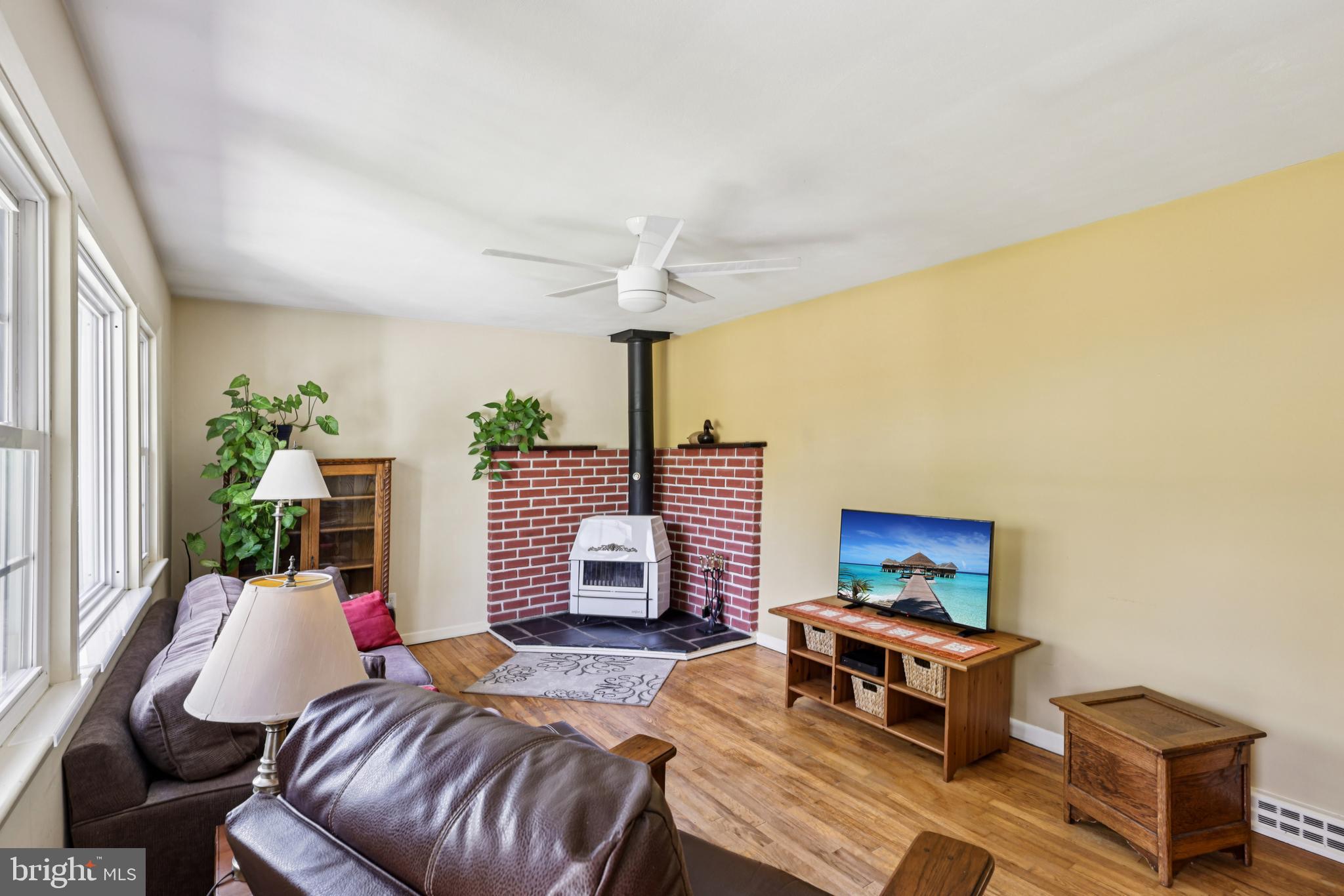 1407 Trenton Harbourton Road Pennington, NJ 08534 - Photo 6 of 31 a living room with furniture and a flat screen tv
