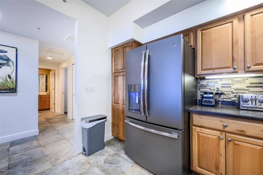 3313 Sunset Key Circle, Unit 104 Punta Gorda, FL 33955 - Photo 13 of 57 a kitchen with stainless steel appliances granite countertop a refrigerator and a sink