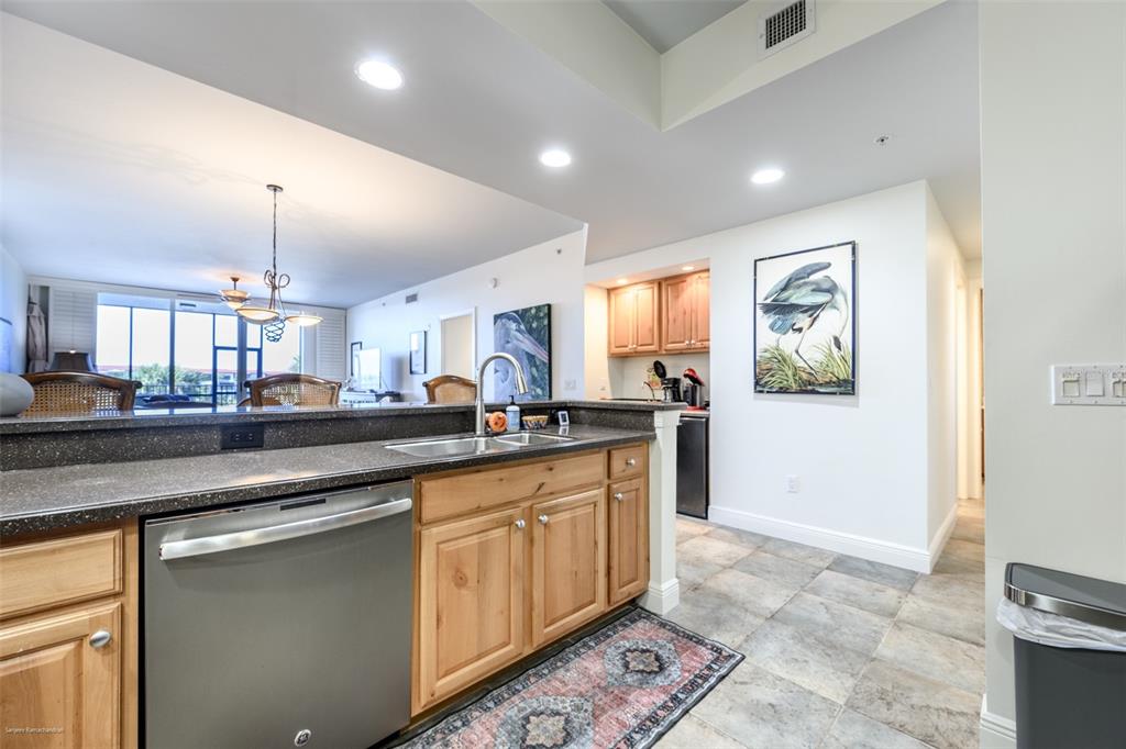 3313 Sunset Key Circle, Unit 104 Punta Gorda, FL 33955 - Photo 14 of 57 a kitchen with lots of counter space and a window