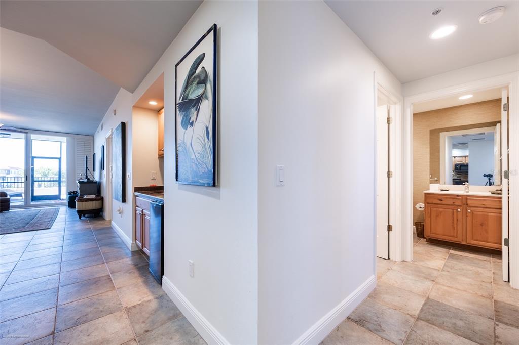 3313 Sunset Key Circle, Unit 104 Punta Gorda, FL 33955 - Photo 15 of 57 a view of a hallway with furniture and a livingroom