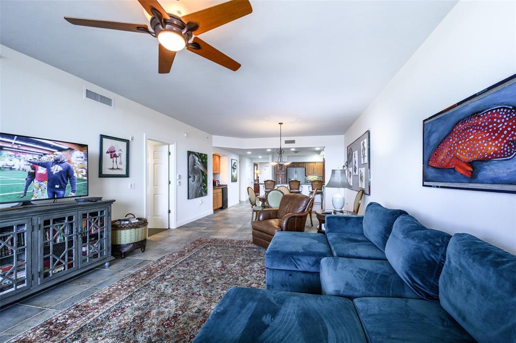 3313 Sunset Key Circle, Unit 104 Punta Gorda, FL 33955 - Photo 25 of 57 a living room with furniture and wooden floor