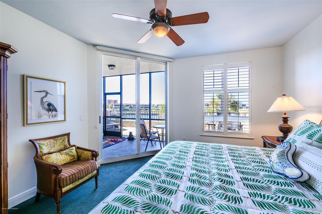 3313 Sunset Key Circle, Unit 104 Punta Gorda, FL 33955 - Photo 30 of 57 a bedroom with a bed couch and window