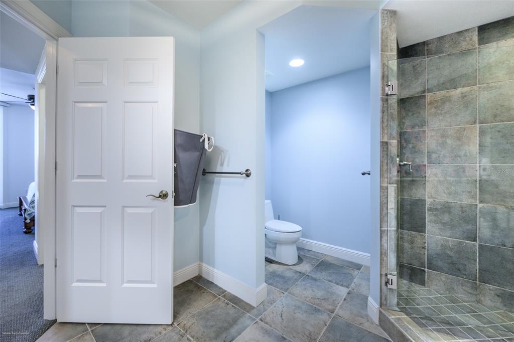 3313 Sunset Key Circle, Unit 104 Punta Gorda, FL 33955 - Photo 35 of 57 a bathroom with a toilet and a shower