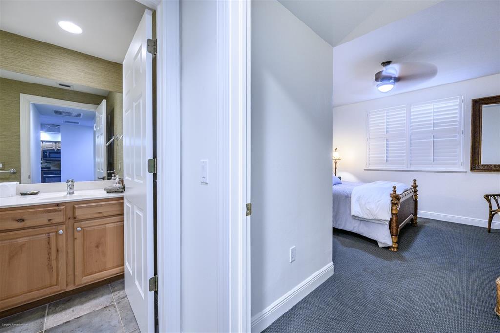 3313 Sunset Key Circle, Unit 104 Punta Gorda, FL 33955 - Photo 37 of 57 a spacious bathroom with a tub sink and mirror