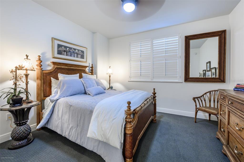 3313 Sunset Key Circle, Unit 104 Punta Gorda, FL 33955 - Photo 39 of 57 a bed room with a bed and two windows