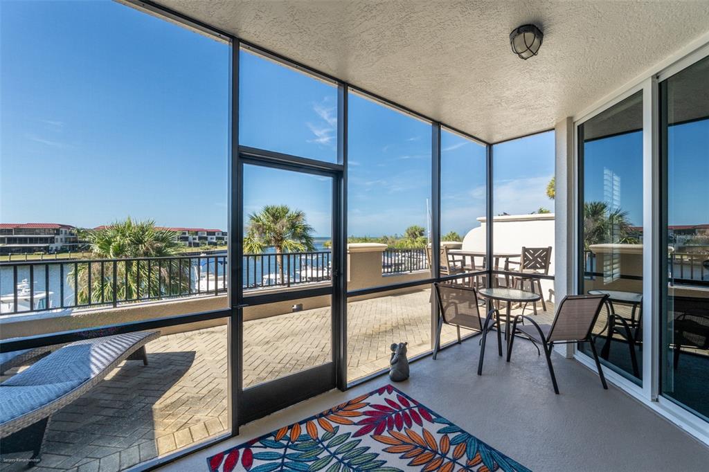 3313 Sunset Key Circle, Unit 104 Punta Gorda, FL 33955 - Photo 46 of 57 a view of a living room and floor to ceiling window or wooden floor
