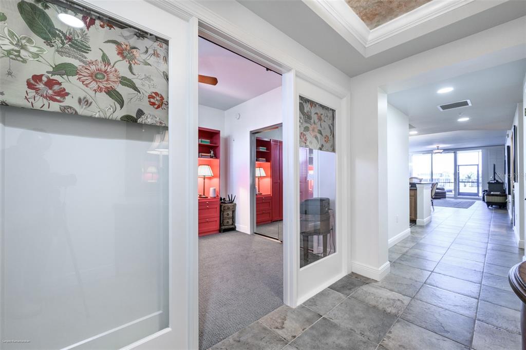 3313 Sunset Key Circle, Unit 104 Punta Gorda, FL 33955 - Photo 5 of 57 a view of a hallway with dining area and chandelier