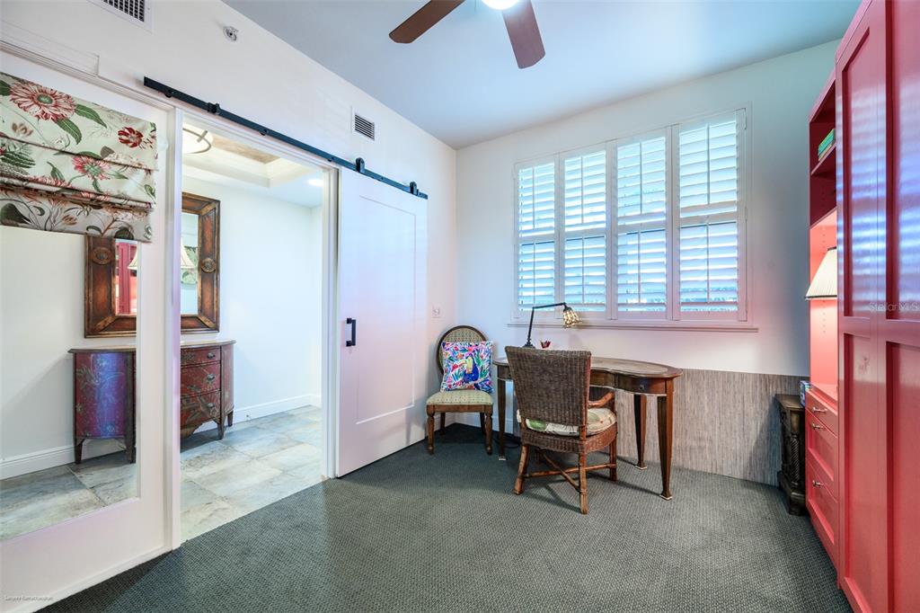 3313 Sunset Key Circle, Unit 104 Punta Gorda, FL 33955 - Photo 9 of 57 a view of a workspace with furniture and a window