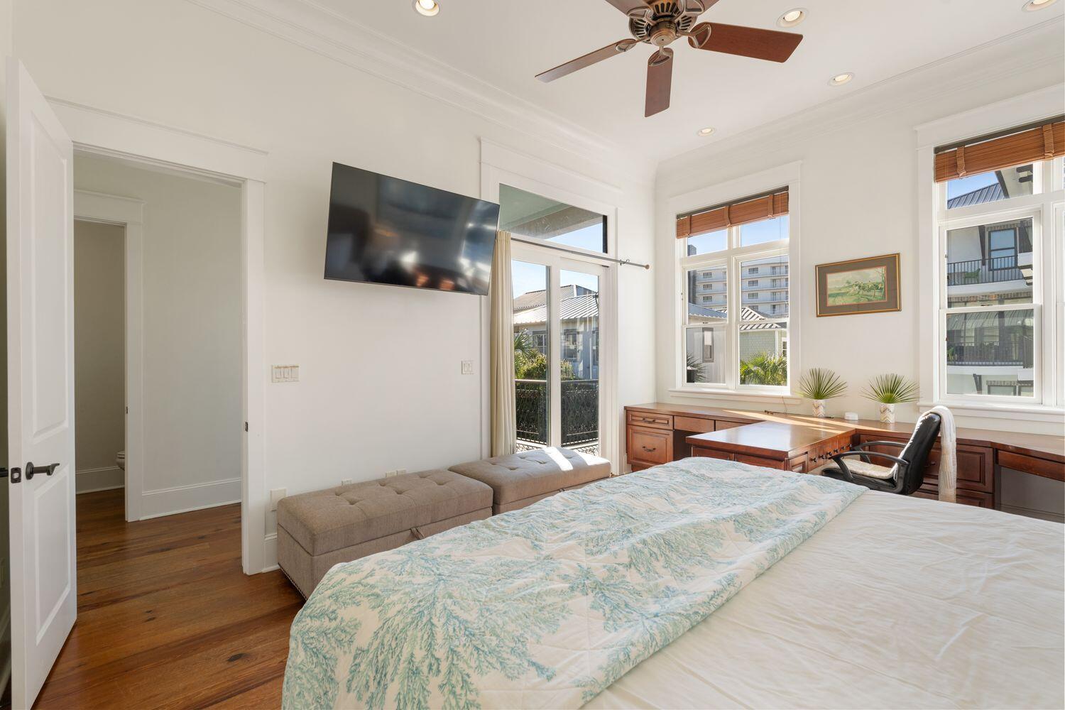 216 Sandtrap Road Miramar Beach, FL 32550 - Photo 23 of 66 a bedroom with a bed and a chandelier