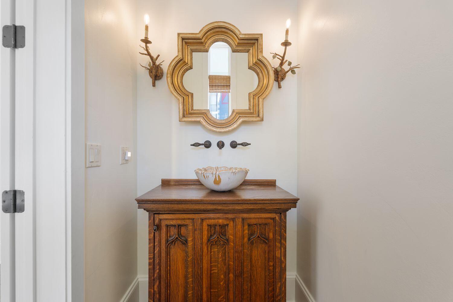 216 Sandtrap Road Miramar Beach, FL 32550 - Photo 26 of 66 a view of a bathroom with a sink and a mirror