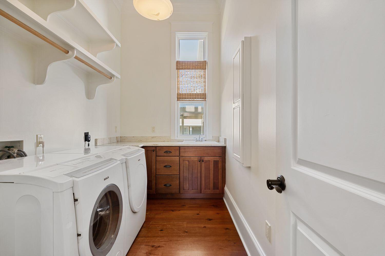 216 Sandtrap Road Miramar Beach, FL 32550 - Photo 27 of 66 a view of a hallway with washer and dryer