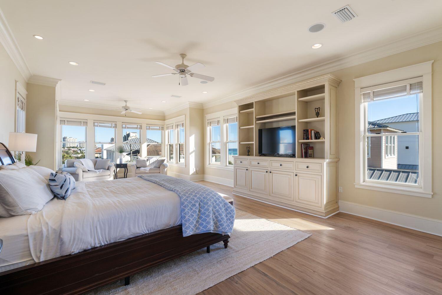 216 Sandtrap Road Miramar Beach, FL 32550 - Photo 29 of 66 a bedroom with a large bed a flat tv screen and dresser