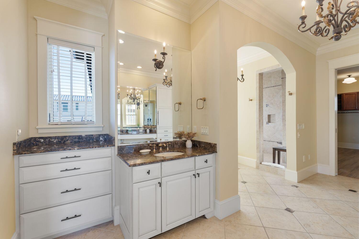 216 Sandtrap Road Miramar Beach, FL 32550 - Photo 35 of 66 a bathroom with a granite countertop sink a mirror and a