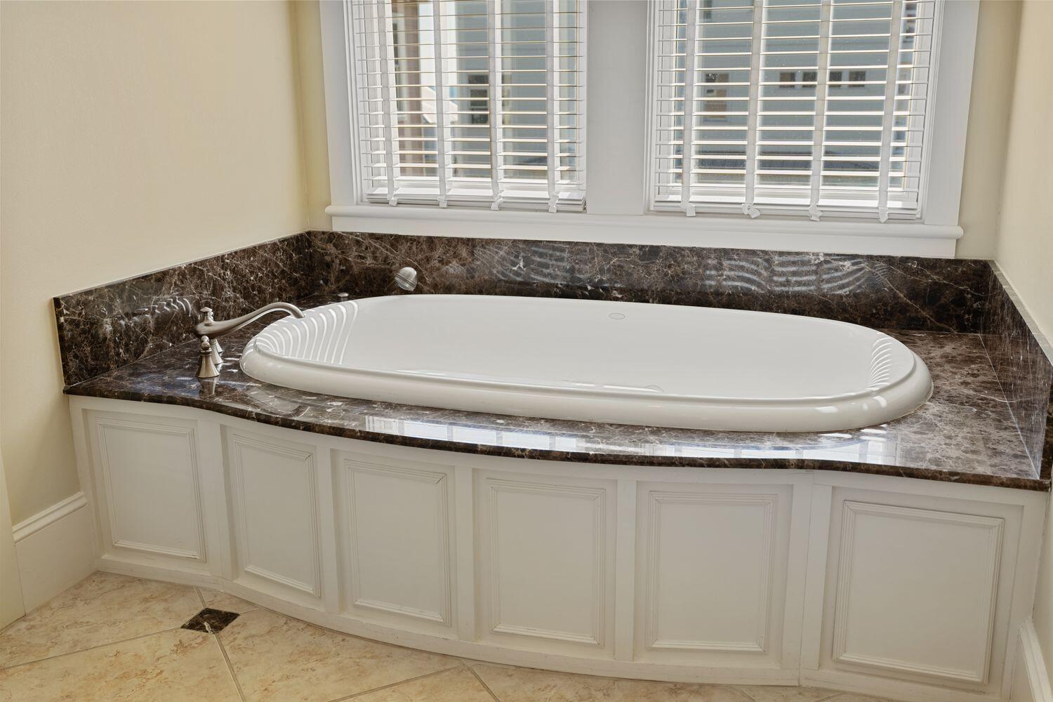 216 Sandtrap Road Miramar Beach, FL 32550 - Photo 38 of 66 a bathroom with a granite countertop tub and a window