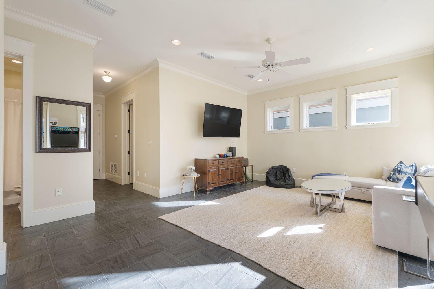 216 Sandtrap Road Miramar Beach, FL 32550 - Photo 45 of 66 a living room with furniture and a flat screen tv
