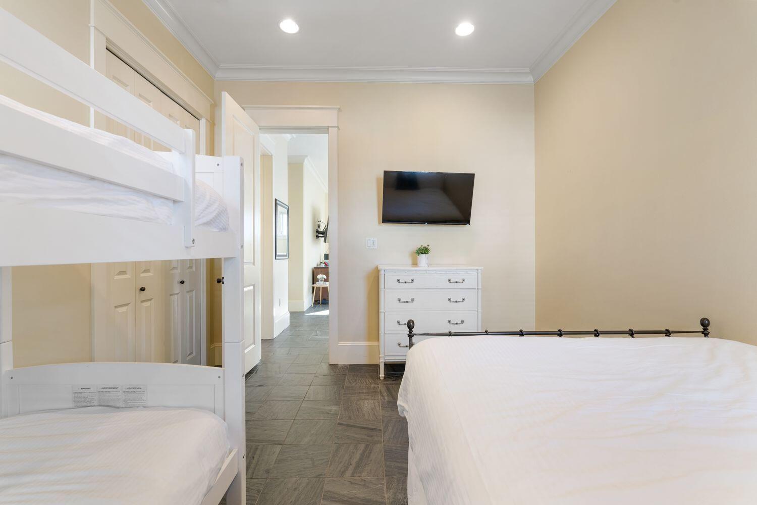 216 Sandtrap Road Miramar Beach, FL 32550 - Photo 49 of 66 a bedroom with a bed and a flat screen tv