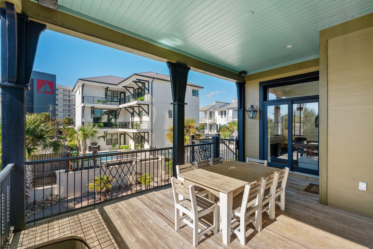 216 Sandtrap Road Miramar Beach, FL 32550 - Photo 56 of 66 a view of a balcony dining table and chairs