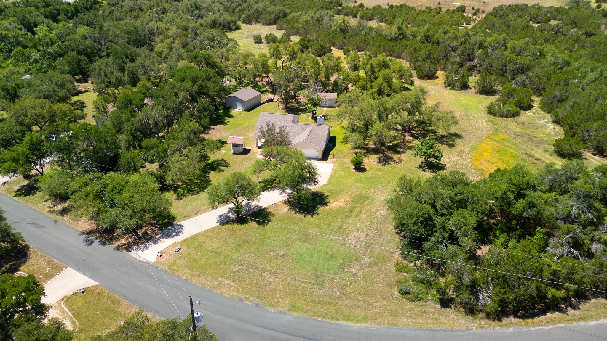 11019 Southwest Oaks Austin, TX 78737 - Photo 34 of 39 The one-acre lot offers serene open spaces with the perfect tree canopy.