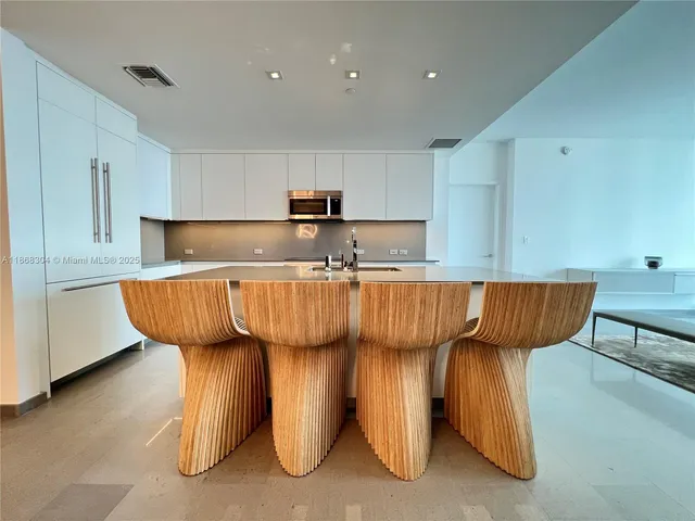 a kitchen with counter top space and appliances