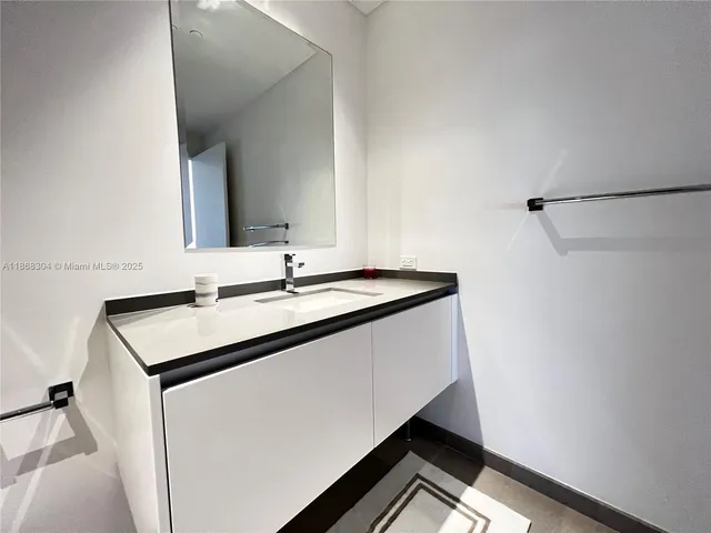 a utility room with sink dryer and washer