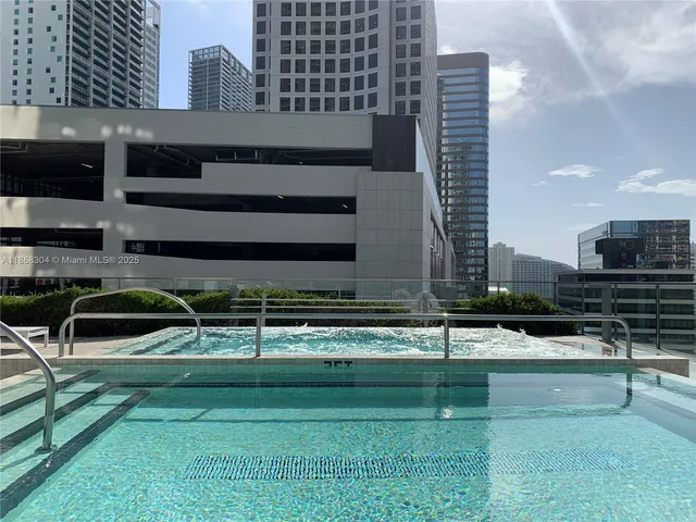 a view of a chair and table in the back yard