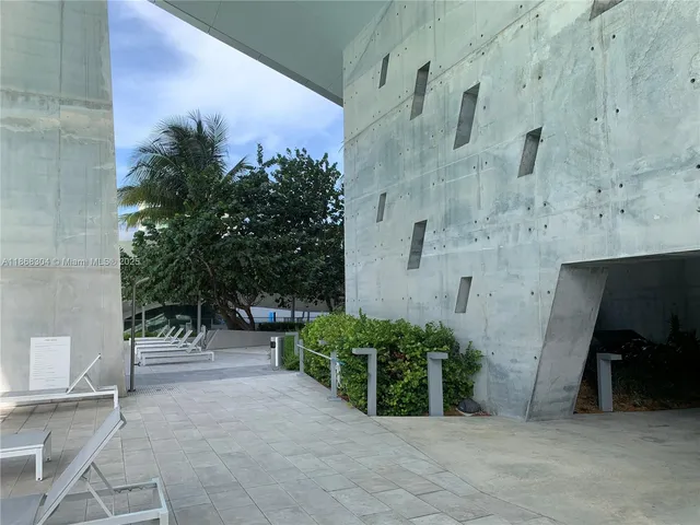 a living room with a large window and a table