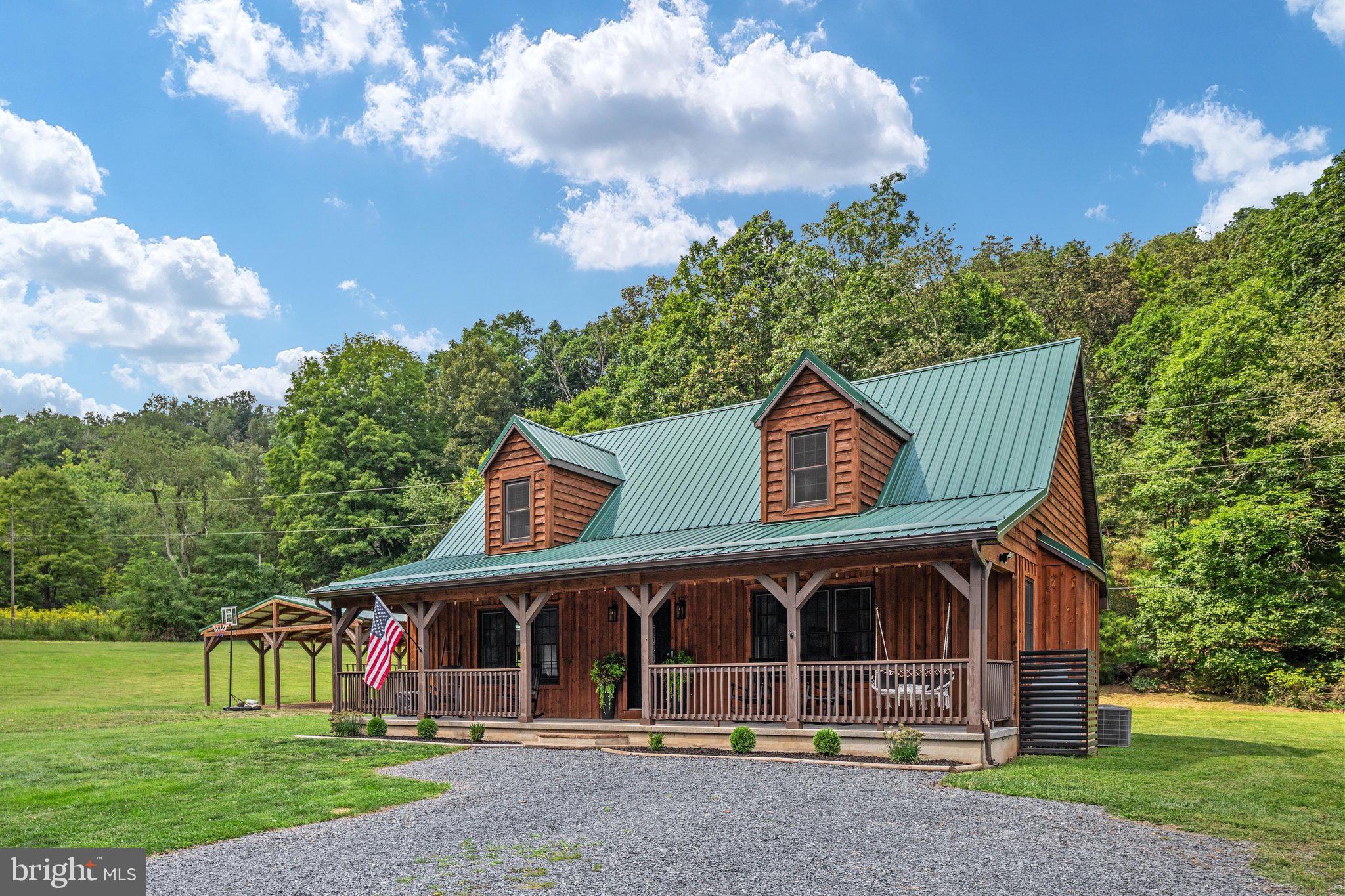 1396 Cullers Run Road Mathias, WV 26812 - Photo 43 of 79 Charming cabin nestled in lush greenery.