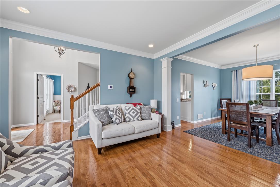 9031 Pathfinder Road Breinigsville, PA 18031 - Photo 7 of 63 Rich hardwood floors flow through this welcoming living space.