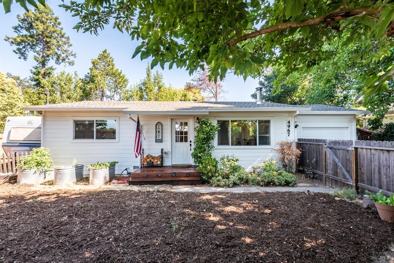 4967 Occidental Road Santa Rosa, CA 95401 - Photo 1 of 1 a front view of a house with a garden