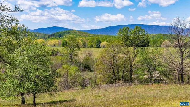 a view of a lake with a mountain in the background