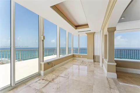 a view of an entryway with a door and windows