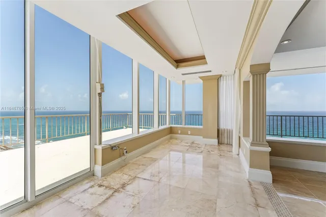 a view of an entryway with a door and windows