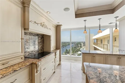 a view of a kitchen with a window and refrigerator
